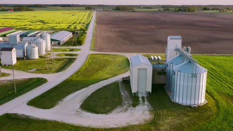 Aerial view, A modern grain elevator in an agricultural landscape. Video stock 275855156