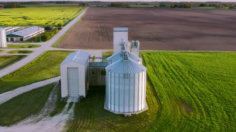 Aerial view with modern grain storage and drying tanks. Modern silos. Video stock 288192156