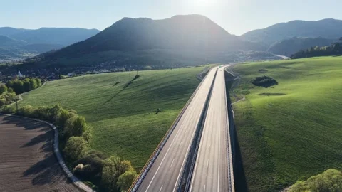 Aerial view of modern highway interchange and empty motorway Stock Footage 335070048