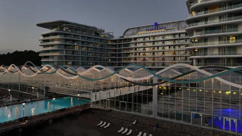Aerial view of Modern hotel Paragraph with a huge swimming pool going to the sea Stock Footage 319076418