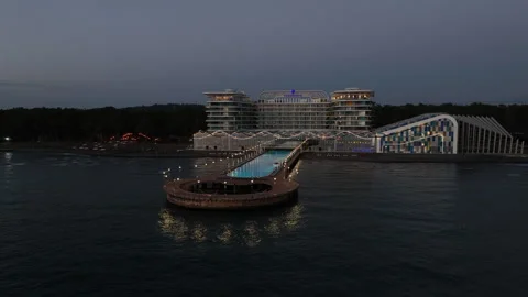 Aerial view of Modern hotel Paragraph with a huge swimming pool going to the sea Video stock 319076735