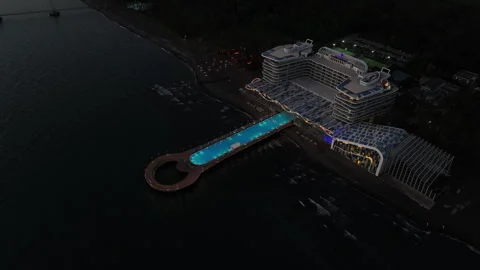Aerial view of Modern hotel Paragraph with a huge swimming pool going to the sea Video stock 319076881