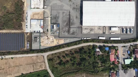 Aerial view of modern logistics warehouse facility with solar panel array a.. Stock Footage 337783175