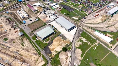 Aerial View of a Modern Logistics Warehouse in an Industrial District Stock Footage 339245190