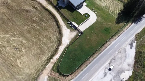 Aerial View of Modern Mountain Chalet and Countryside Road Vídeo Stock 344382589