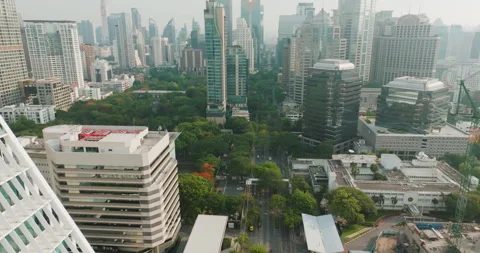 Aerial view modern office building with green Lumpini public park Silom disrict Stock Footage 278721618