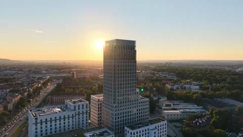 Aerial view of modern office building at sunset. Downtown during sunrice Stockbeeldmateriaal 340900004