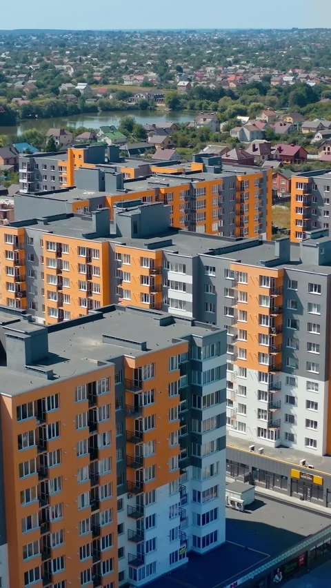 Aerial view of modern orange and grey apartment complex in developing subur.. Stock Footage 337482310