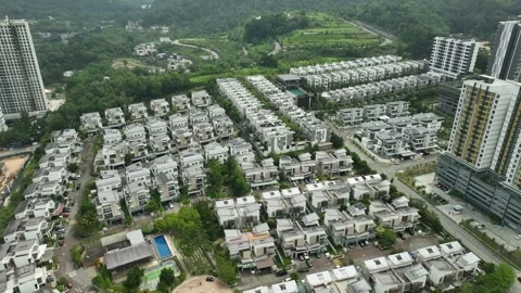 Aerial View of Modern Residential Complex Surrounded by Lush Greenery Stock Footage 311575609