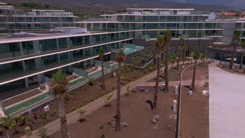 Aerial view of a modern residential complex featuring contemporary apartment Vídeo Stock 345010062