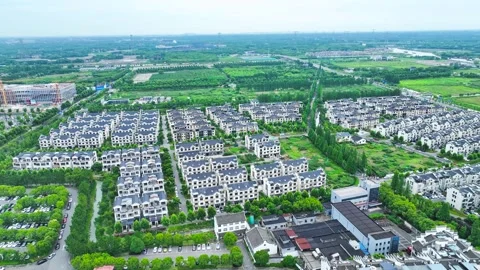 Aerial View of Modern Residential Development in Rural Chinese Landscape Stock Footage 342091109