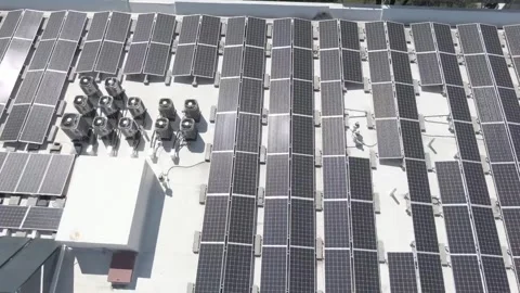 Aerial View of Modern Solar Panel Grid on Rooftop Stock Footage 328392979