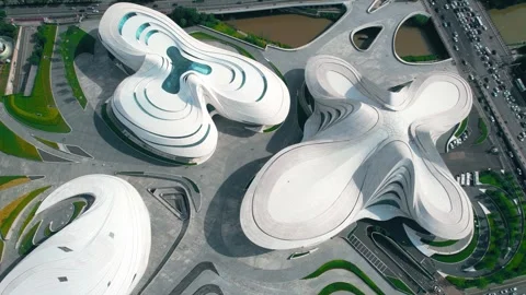 Aerial View of Modern White Architectural Complex and Surrounding City Traffic Stock Footage 342120489
