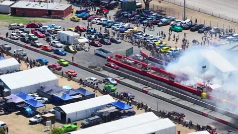 Aerial View of Modified Car Performing Burnout at Summernats Festival Stock Footage 326278015