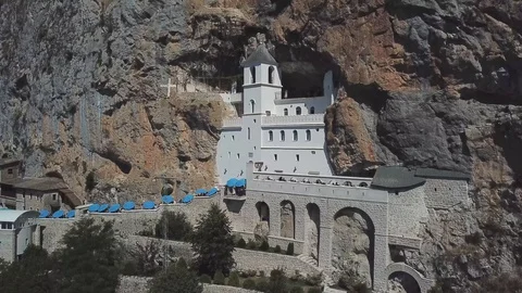 Aerial view of The Monastery of Ostrog, Serbian Orthodox Church. Montenegro Stock Footage 129669698