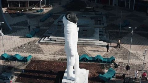 Aerial view of Monkey statue in front of Office Building complex Jauna Teika Stock-Footage 127581154