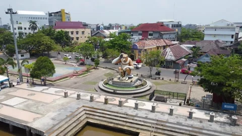 Aerial view of the monkey statue as a typical monument in Banjarmasin in th.. Stock Footage 254455536