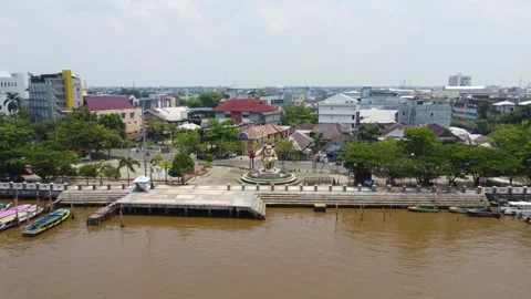 Aerial view of the monkey statue as a typical monument in Banjarmasin in th.. Stock Footage 254457041