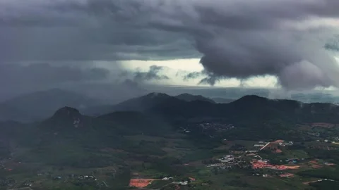 Aerial view of Monsoon clouds rolling through mountain range as storm builds Video stock 316417804