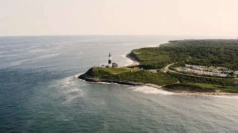 Aerial View of Montauk Lighthouse Surrounded by the Ocean Stock Footage