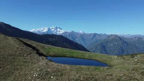 Aerial view of Monte Rosa over a lake Stock Footage 163763182