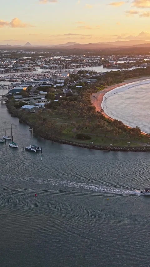 Aerial view of moored yachts on Mooloolah River near beach Queensland Stock Footage 334785720