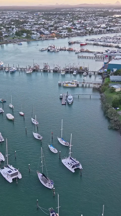 Aerial view of moored yachts on Mooloolah River near beach Queensland Stock-Footage 334785752