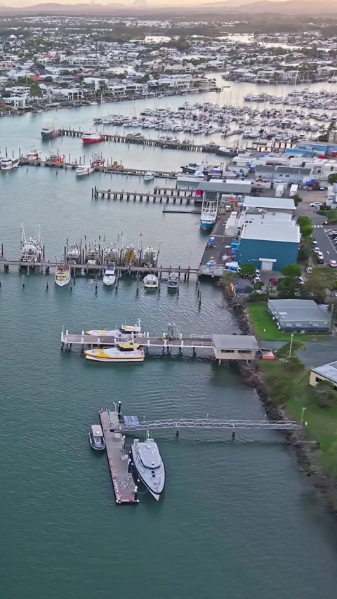 Aerial view of moored yachts on Mooloolah River near beach Queensland Stock Footage 334785753
