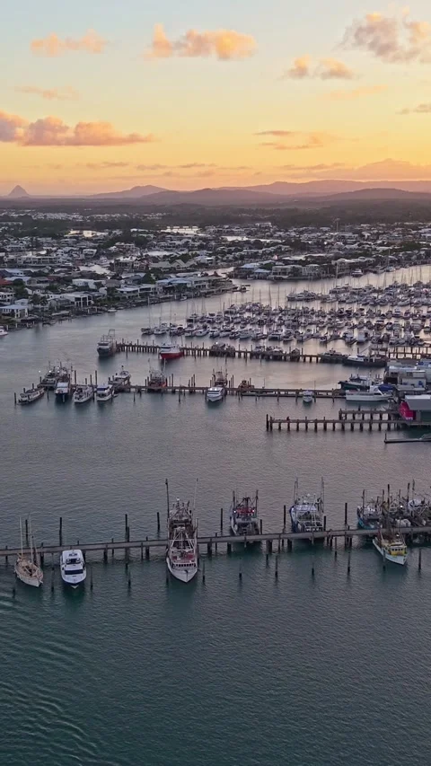 Aerial view of moored yachts on Mooloolah River near beach Queensland Stock Footage 334785816