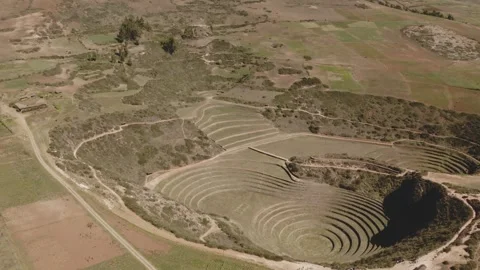 Aerial view of Moray Archeological site. Inca ruins of several terraced circular Stock Footage 247441644