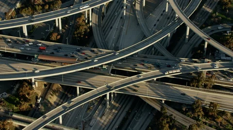 Aerial view of morning commuters using freeway system Los Angeles Stock Footage 64778829