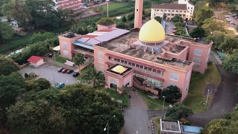 Aerial view of mosque and Kuala Lumpur cityscape during sunrise. Stock Footage 101068940