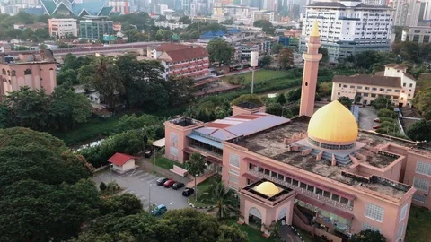 Aerial view of mosque and Kuala Lumpur cityscape during sunrise. Stock Footage 101068942