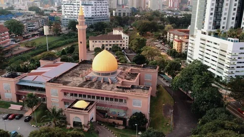Aerial view of mosque and Kuala Lumpur cityscape during sunrise. Stock Footage 101068944