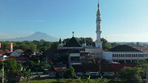 Aerial view of a mosque and Mount Merapi, Indonesia. Stock Footage 335733007