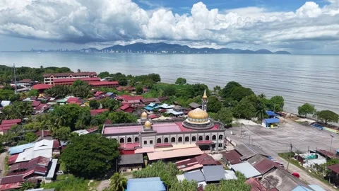 Aerial view of mosque beside calm sea 스톡 동영상 344953857