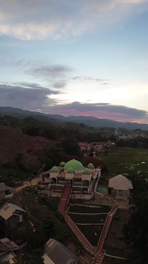 Aerial view of a mosque on the hill in the evening as the sunset Stock-Footage 260370308