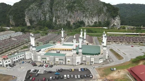 Aerial view of Mosque, parking lot and small town in Gua Musang, kelantan Stock Footage 190808656