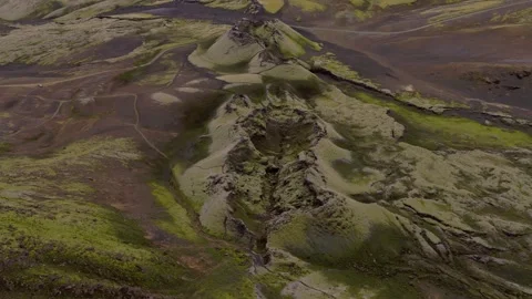 Aerial view of moss-covered volcanic terrain with glacial meltwater channels, Ic Stock Footage 341606129