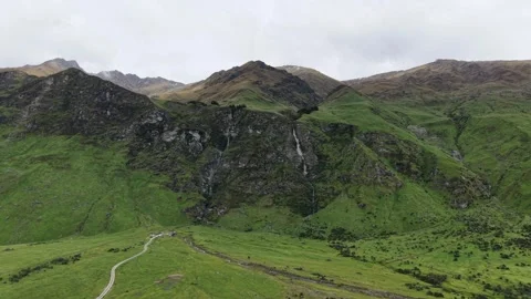 Aerial View of Mount Aspiring Road and Green Valley Near Wanaka Stock Footage 336593179