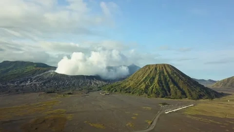Aerial view of Mount Bromo, Mount Batok, and Mount Semeru Stock Footage 236453799