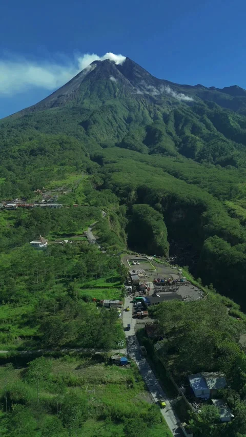 Aerial view of Mount Merapi volcano and lush slopes in Indonesia. Stock Footage 336292272