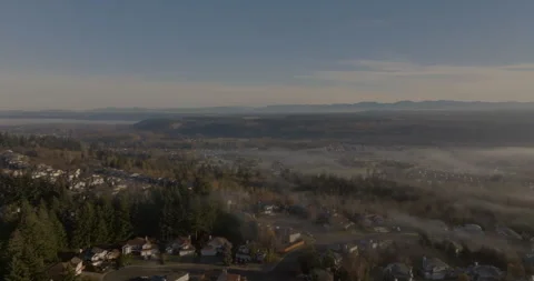 Aerial View of Mount Rainier and Suburban Landscape in Morning Mist Stock Footage 294107635