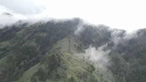 AERIAL VIEW MOUNT RINAJNI WHEN CLOUDY Stock Footage 231859694