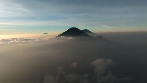 Aerial View of Mount Sindoro Under Warm Sunrise Sky Stock Footage 341778352