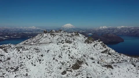 Aerial view of Mount Usu,Mount Yotei and Lake Toya Stock Footage