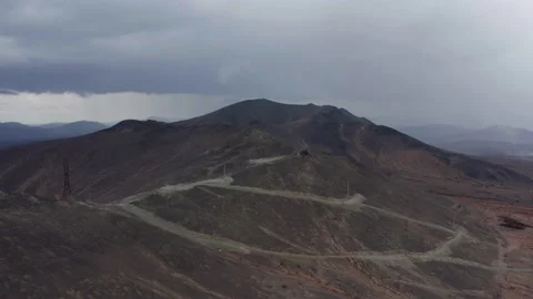 Aerial view of the mountain against the background of clouds and a mountain Stock Footage 165801341