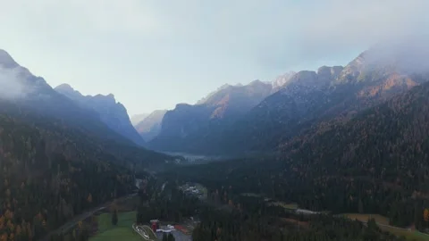 Aerial view of mountain alpine town Dobbiaco and mountains around, Italy Stock Footage 302845839