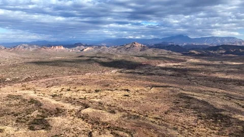 Aerial view of mountain and flatiron under cloudy sky, United States. Stock Footage 312759968
