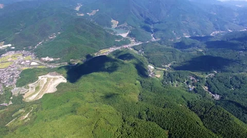 Aerial view of mountain and shadows of moving clouds Stock Footage 68526465